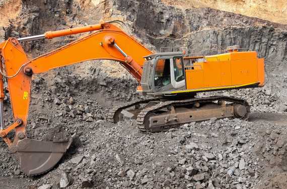 yellow-excavator-digging-ore-rich-rock-open-pit-mine.jpg