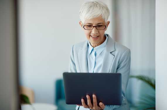 senior-businesswoman-working-on-laptop-in-the-offi-2022-12-13-21-05-08-utc.jpg