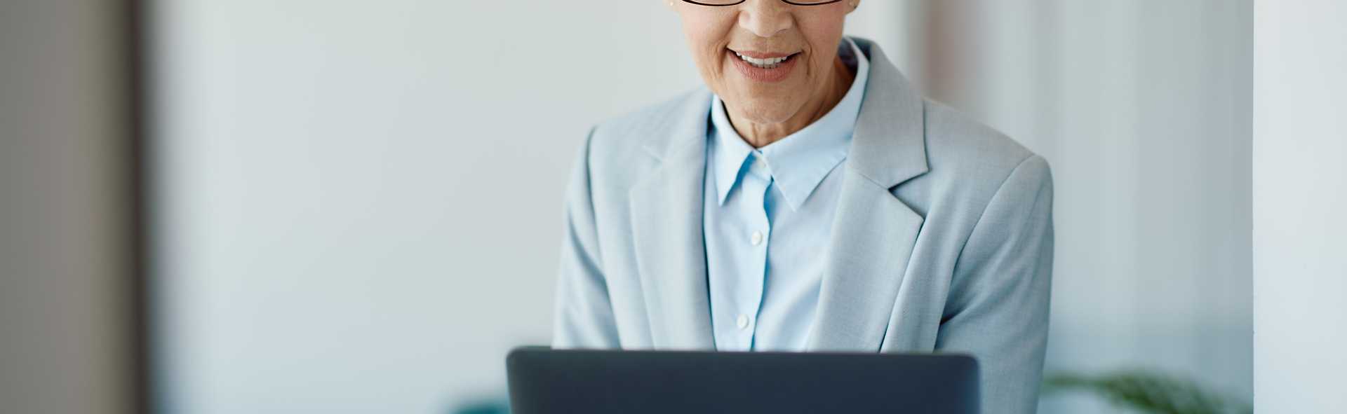 senior-businesswoman-working-on-laptop-in-the-offi-2022-12-13-21-05-08-utc.jpg