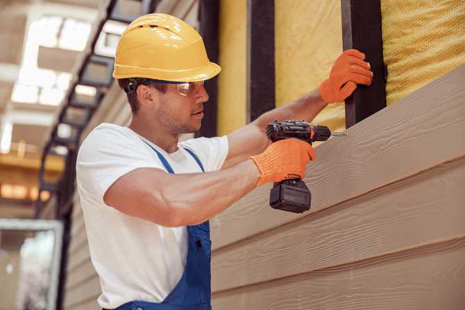 male-builder-using-power-drill-at-construction-sit-2021-12-16-22-29-31-utc.jpg